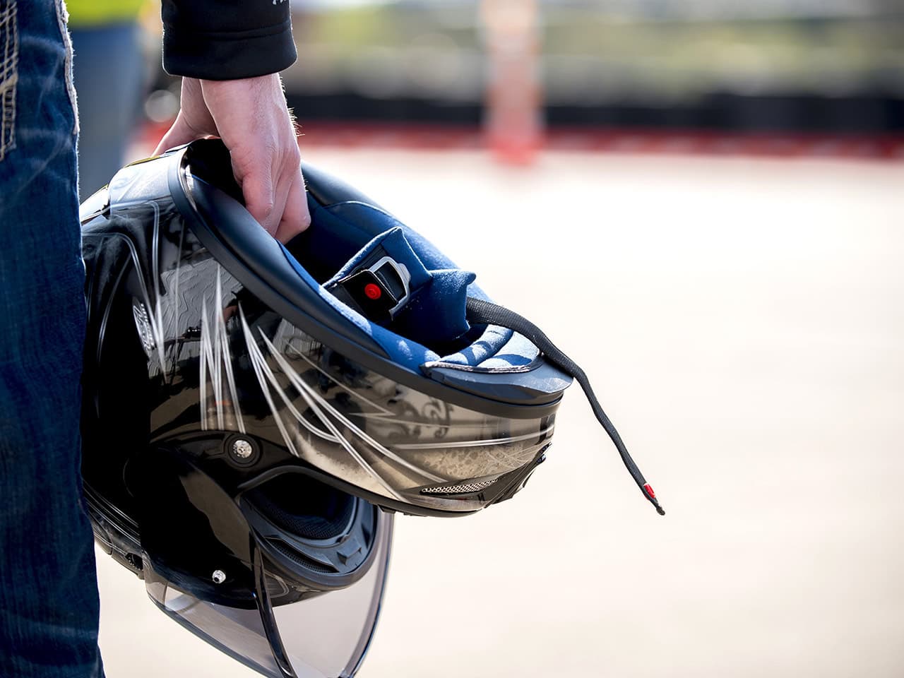 Man holding a motorcycle helmet
